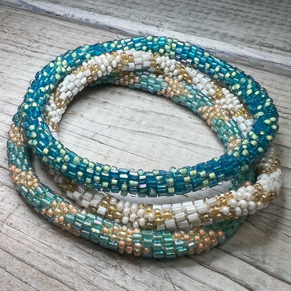 😻 Set of 3 aid-through-trade roll on bracelets! Pretty colors, lovely beadwork